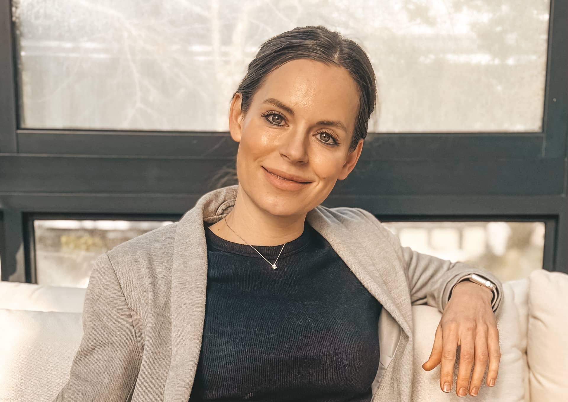 Richelle seated and smiling